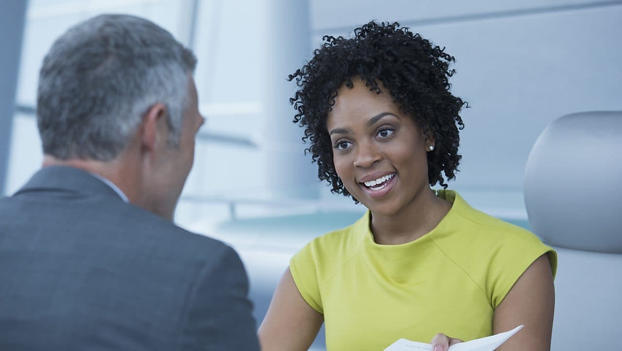An entrepreneur presenting her business to an adviser